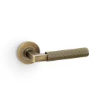 Alexander and Wilks Hurricane Reeded Lever on Round Rose - Antique Brass