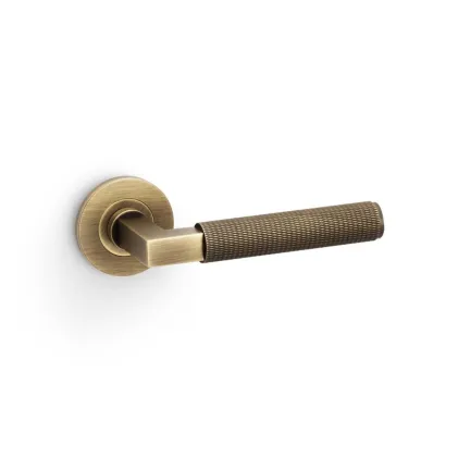 Alexander and Wilks Hurricane Knurled Lever on Round Rose - Antique Brass