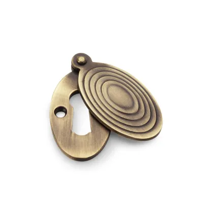 Alexander and Wilks Ellipse Escutcheon with Christoph Design Cover - Antique Brass